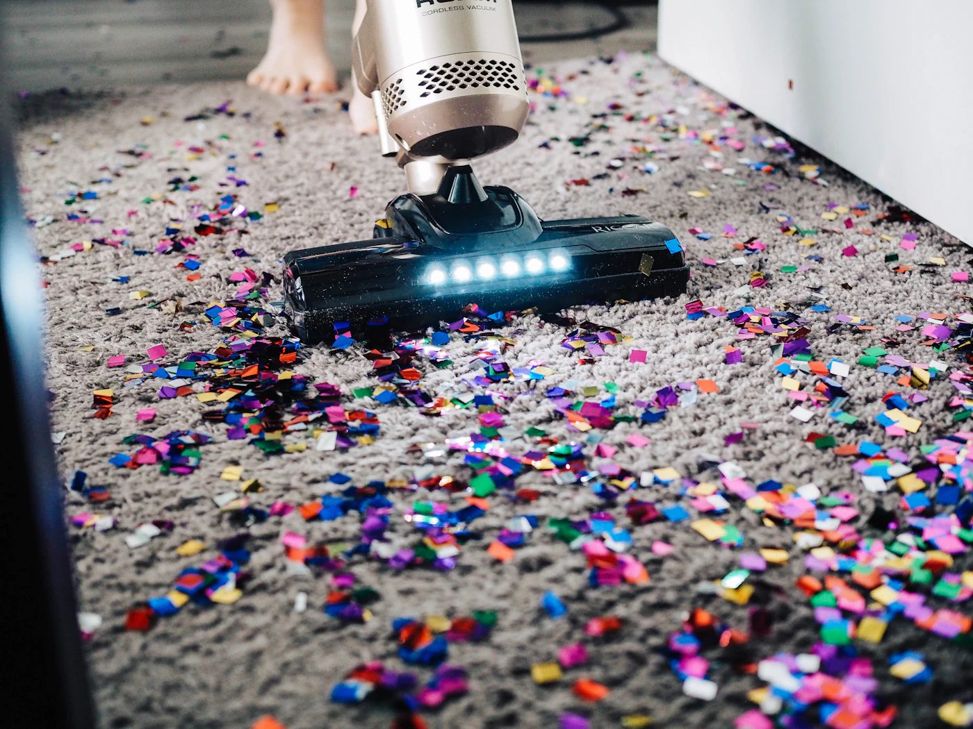 Vacuum cleaner deep cleaning a carpet during a carpet cleaning service