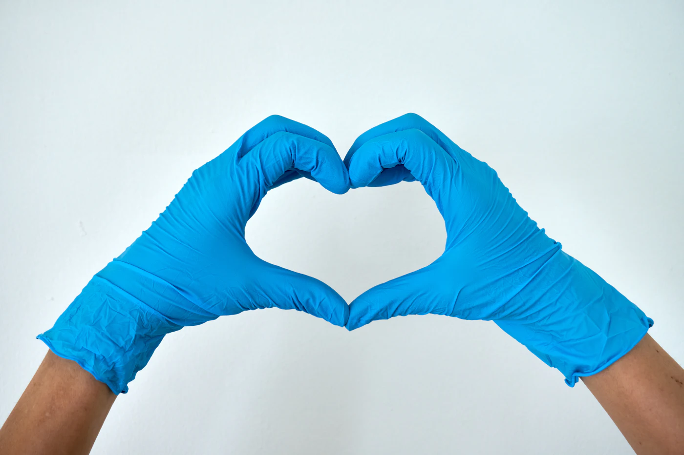 Cleaner tidying a hospitality space with care